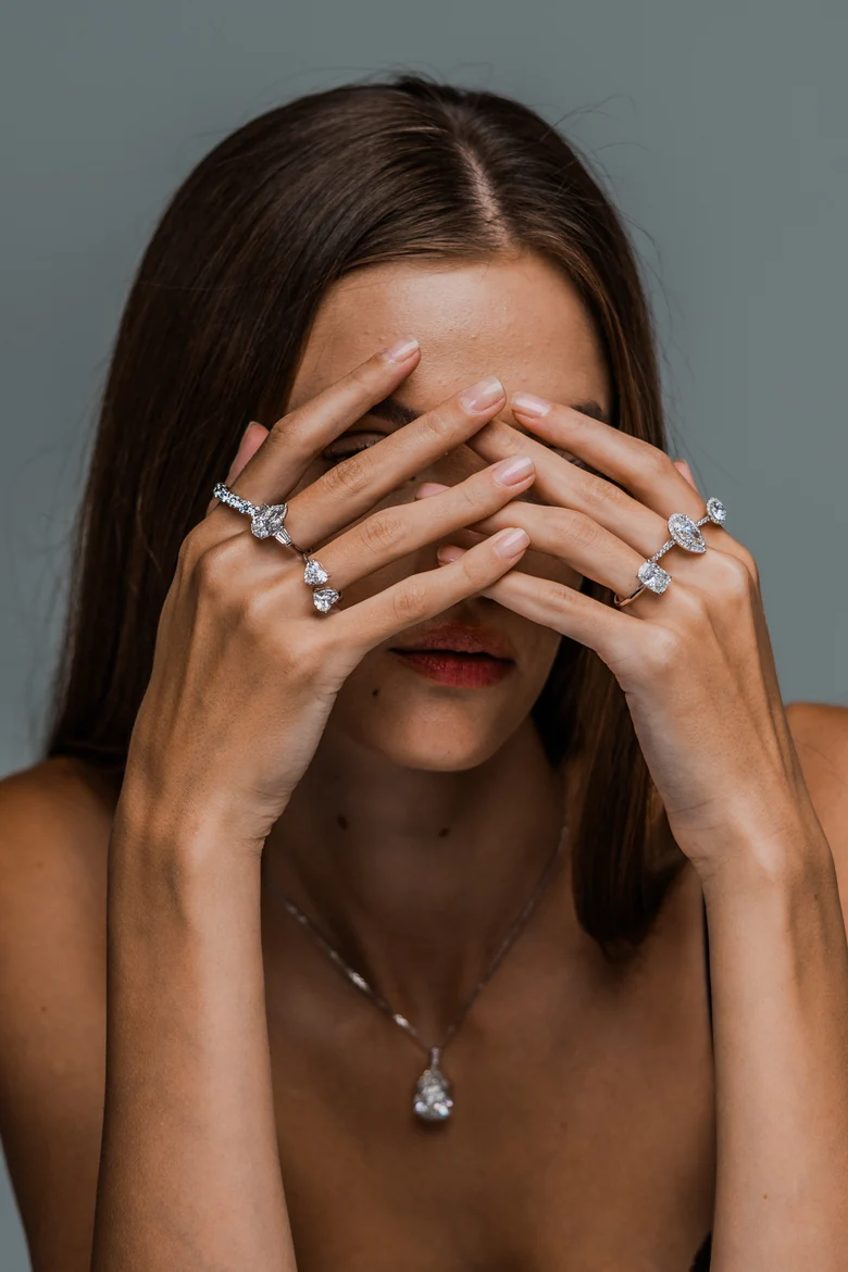 A model wearing Luminore diamond rings on both hands